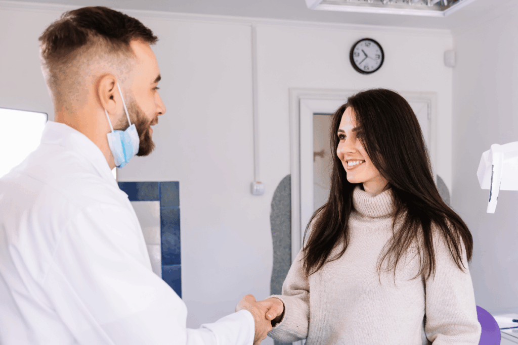 What dental patients really want: transparency and convenience smiling female patient shaking dentist's hand