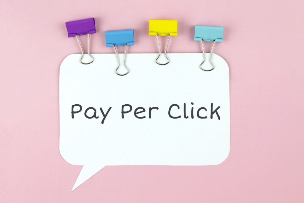 Pay Per Click concept on speech bubble with colorful binder clips