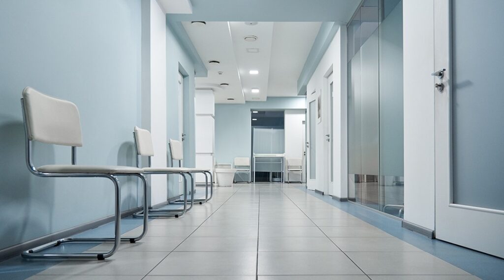Modern dental office waiting area with clean professional lighting and comfortable seating