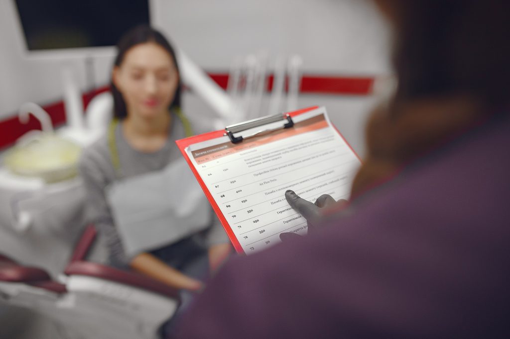 A dental practice owner evaluating an SEO provider, with questions to ask, warning signs to spot, and a focus on new patients rather than rankings, illustrating how to hire SEO help without getting burned